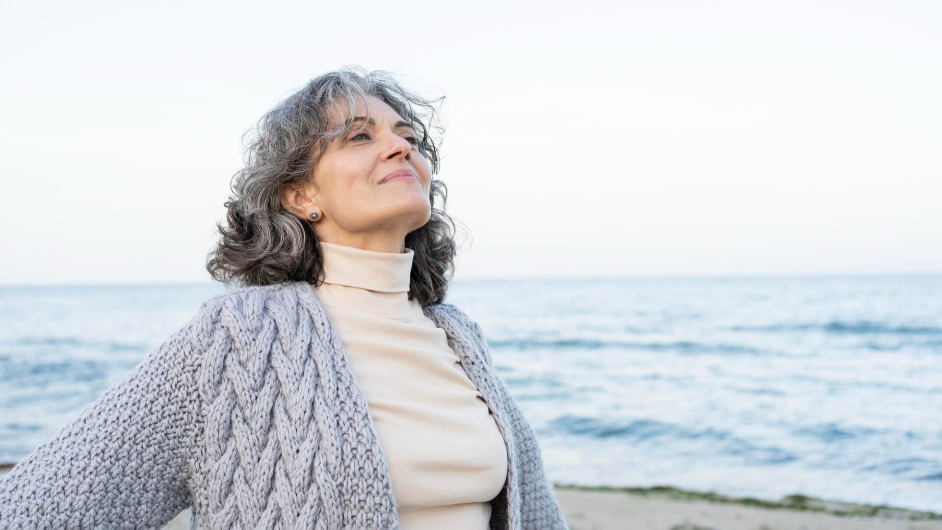 senior woman enjoying her time at the beach