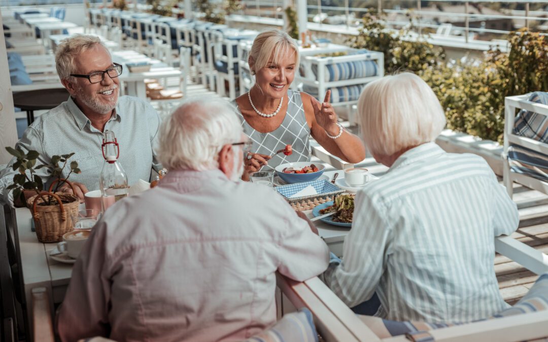 Cheerful bearded man talking to his friends